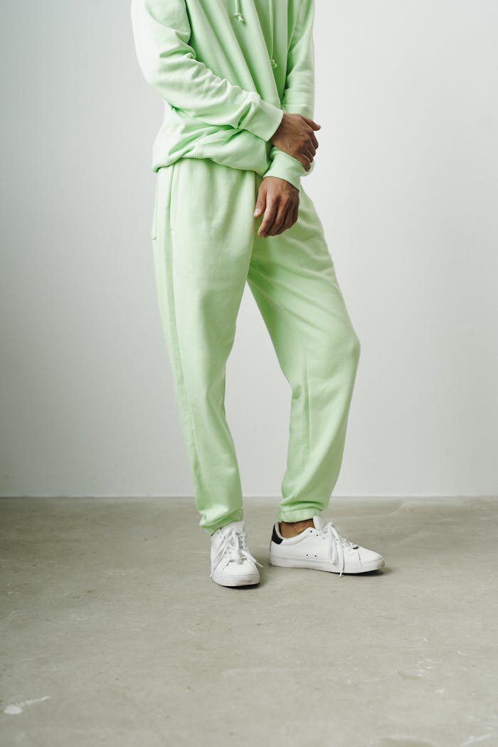 pexels-photo-9775553 Man in a Matching Green Tracksuit Standing on White Background